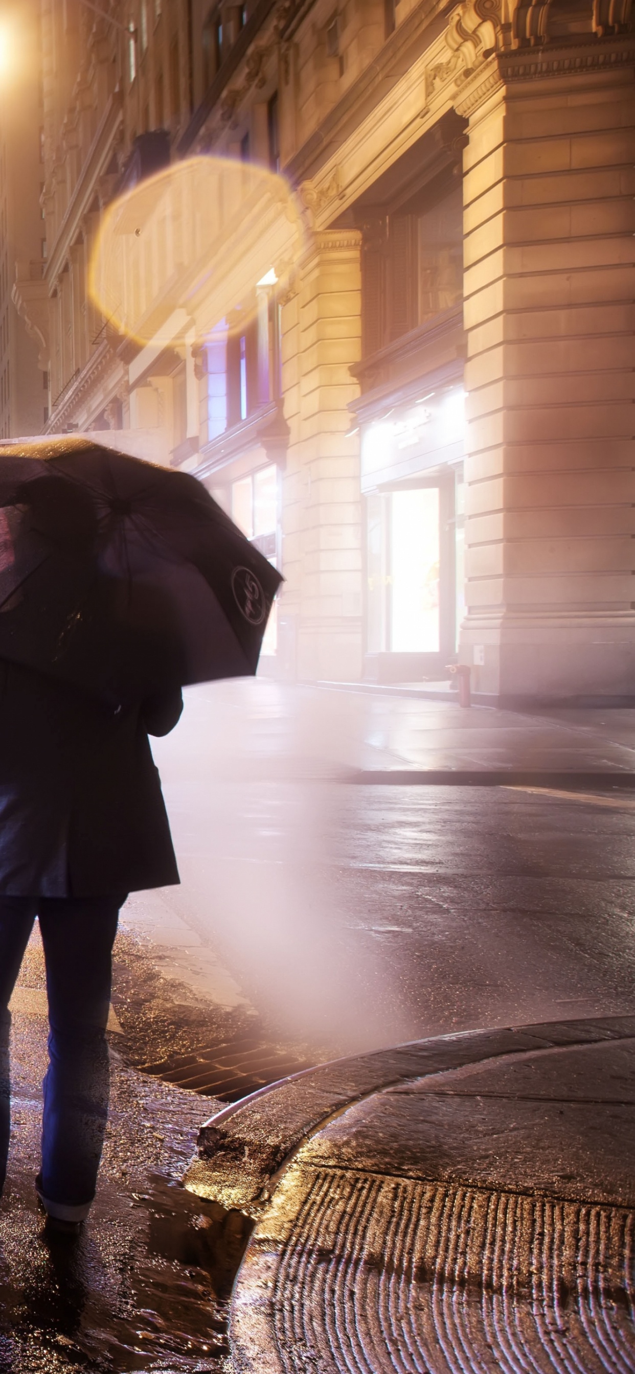 Person Walking on Sidewalk During Night Time. Wallpaper in 1242x2688 Resolution