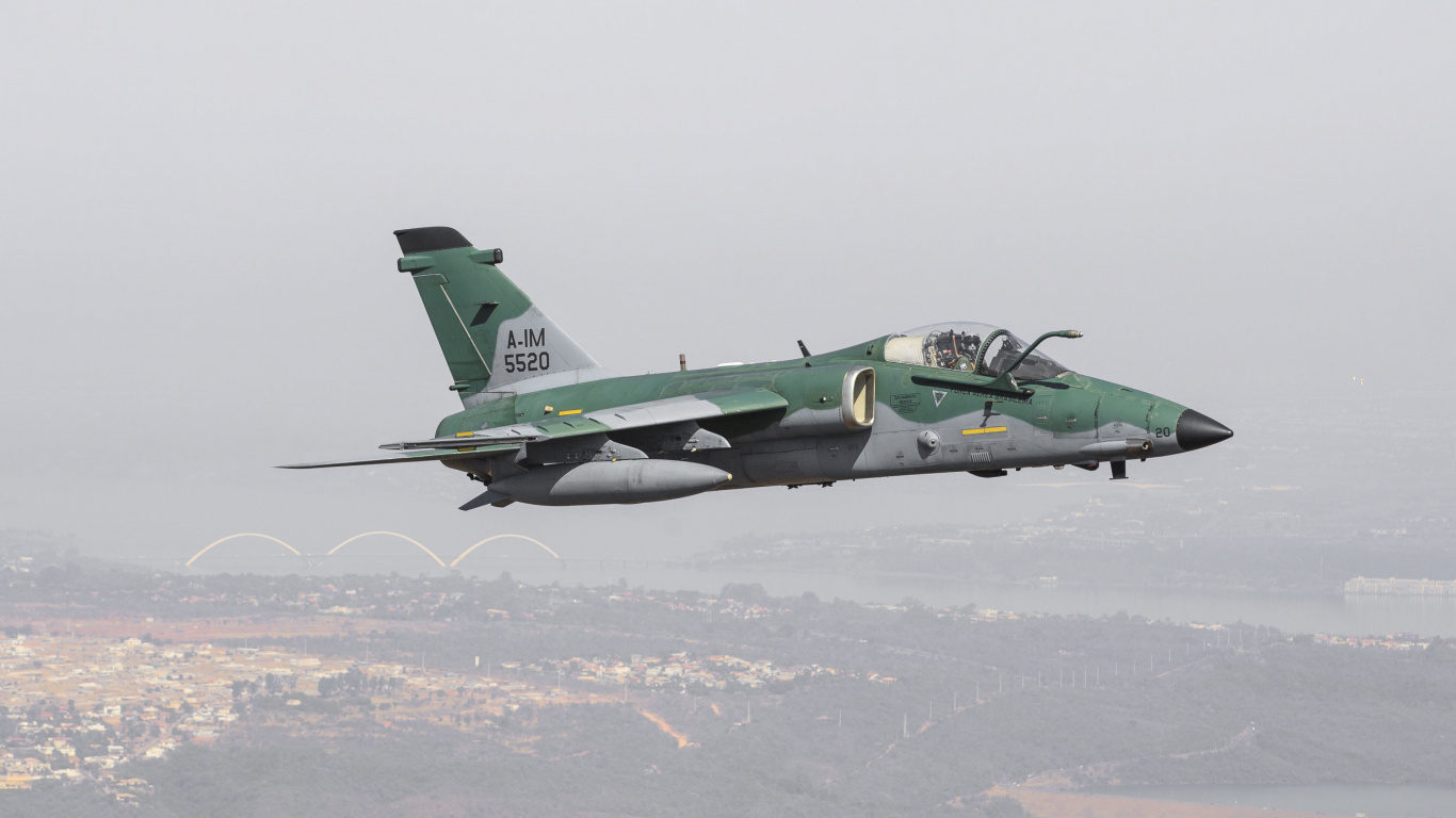 Green and Black Jet Plane Flying Over The White Clouds During Daytime. Wallpaper in 1366x768 Resolution