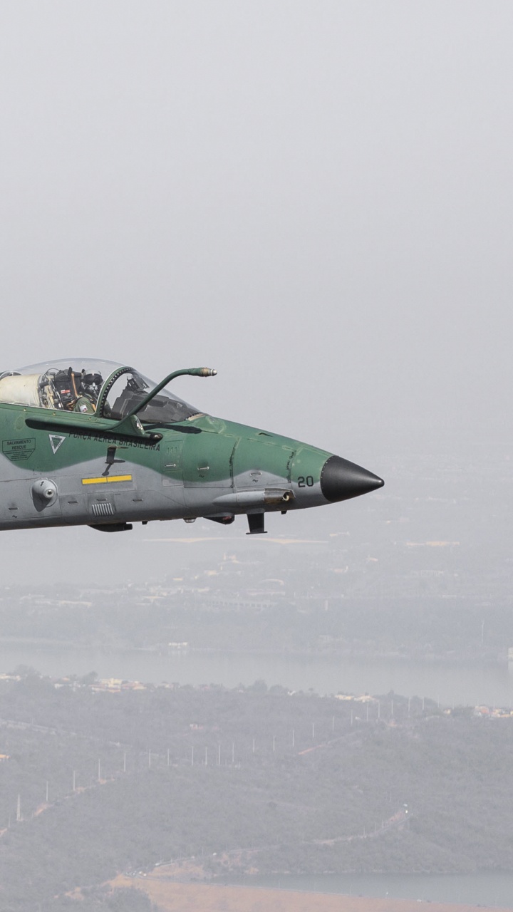 Green and Black Jet Plane Flying Over The White Clouds During Daytime. Wallpaper in 720x1280 Resolution