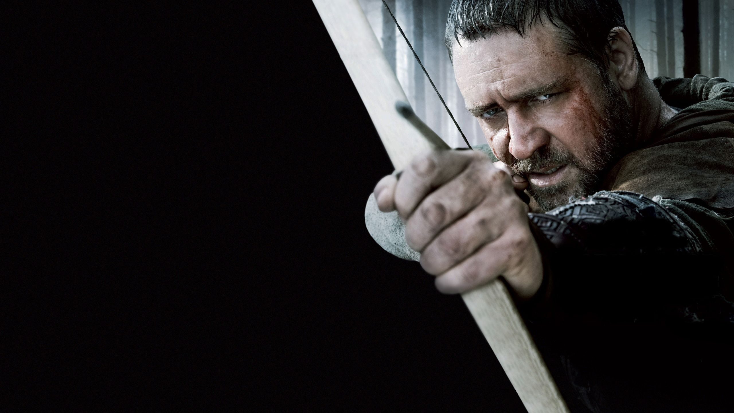 Man in Black and White Floral Shirt Holding Brown Wooden Stick. Wallpaper in 2560x1440 Resolution