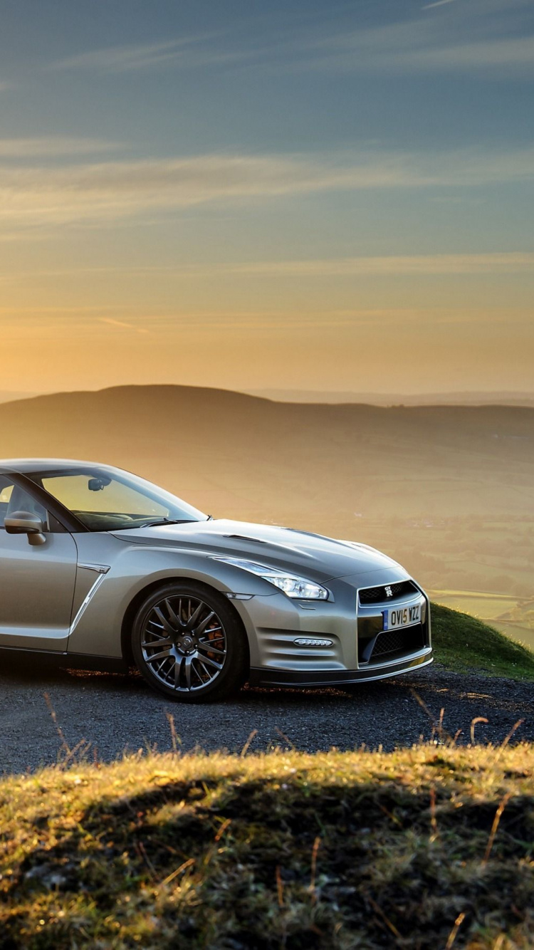 Silver Sedan on Brown Sand During Sunset. Wallpaper in 750x1334 Resolution