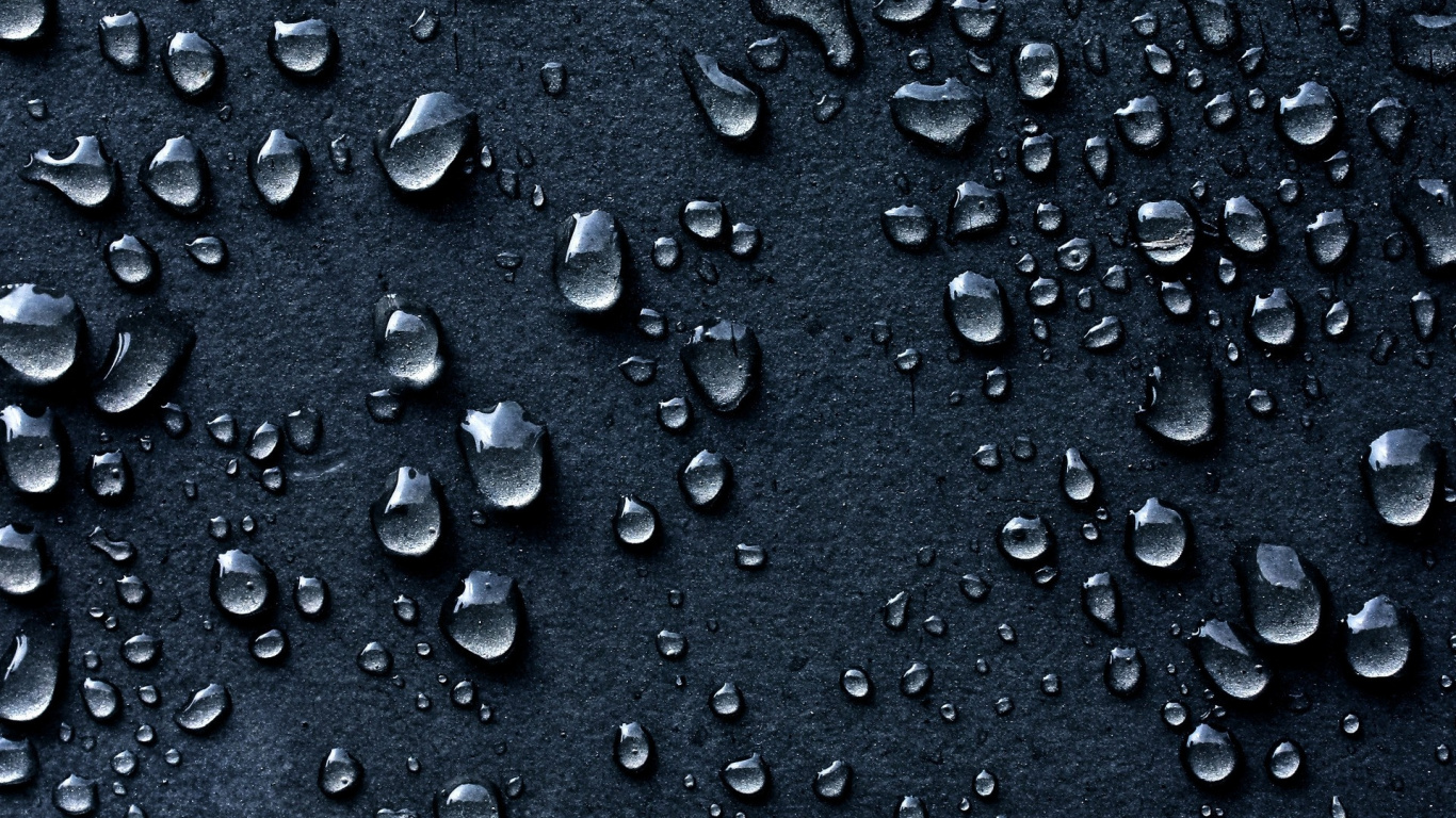 Water Droplets on Black Surface. Wallpaper in 1366x768 Resolution