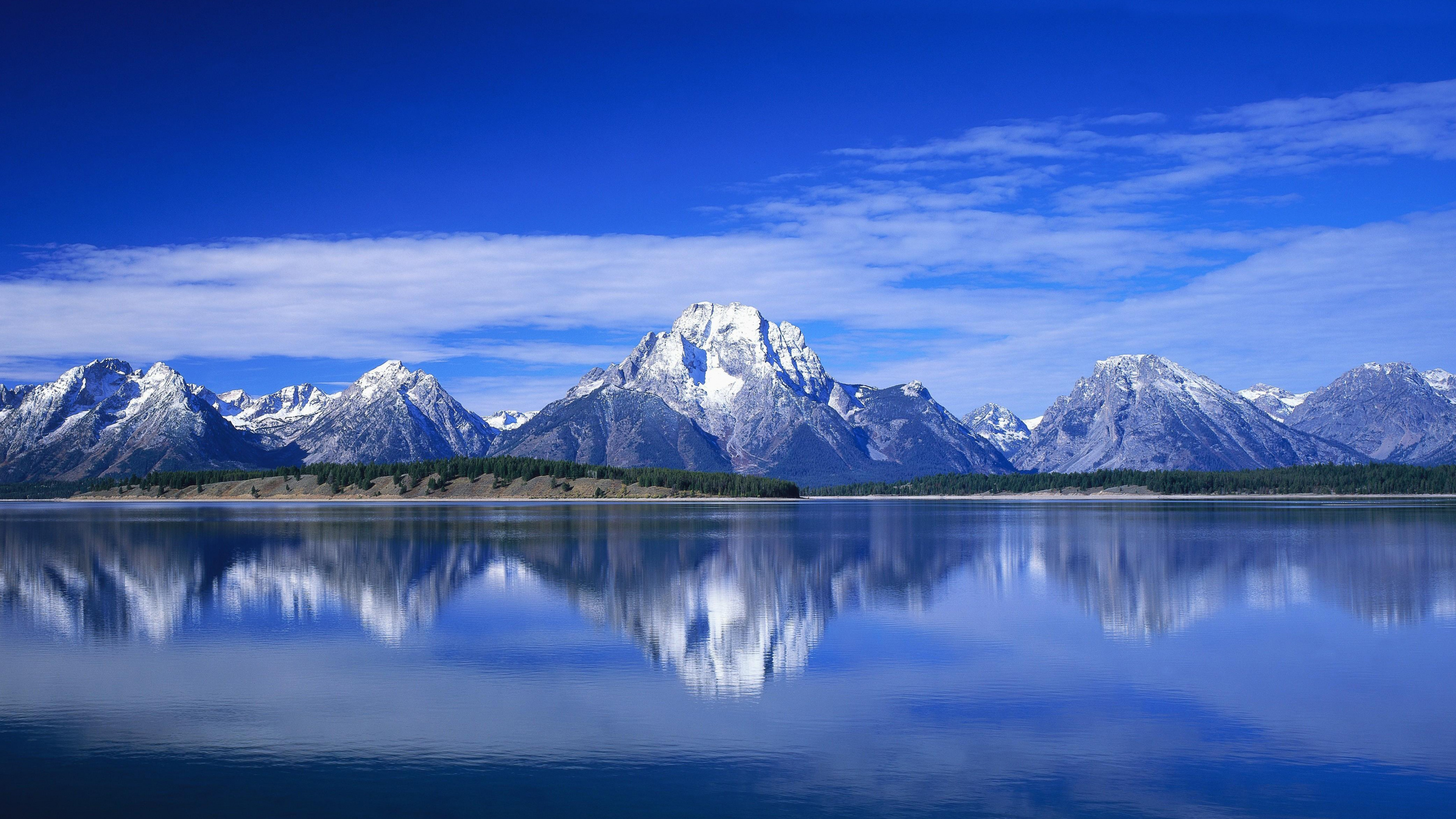 Snow Covered Mountain Near Body of Water During Daytime. Wallpaper in 3840x2160 Resolution