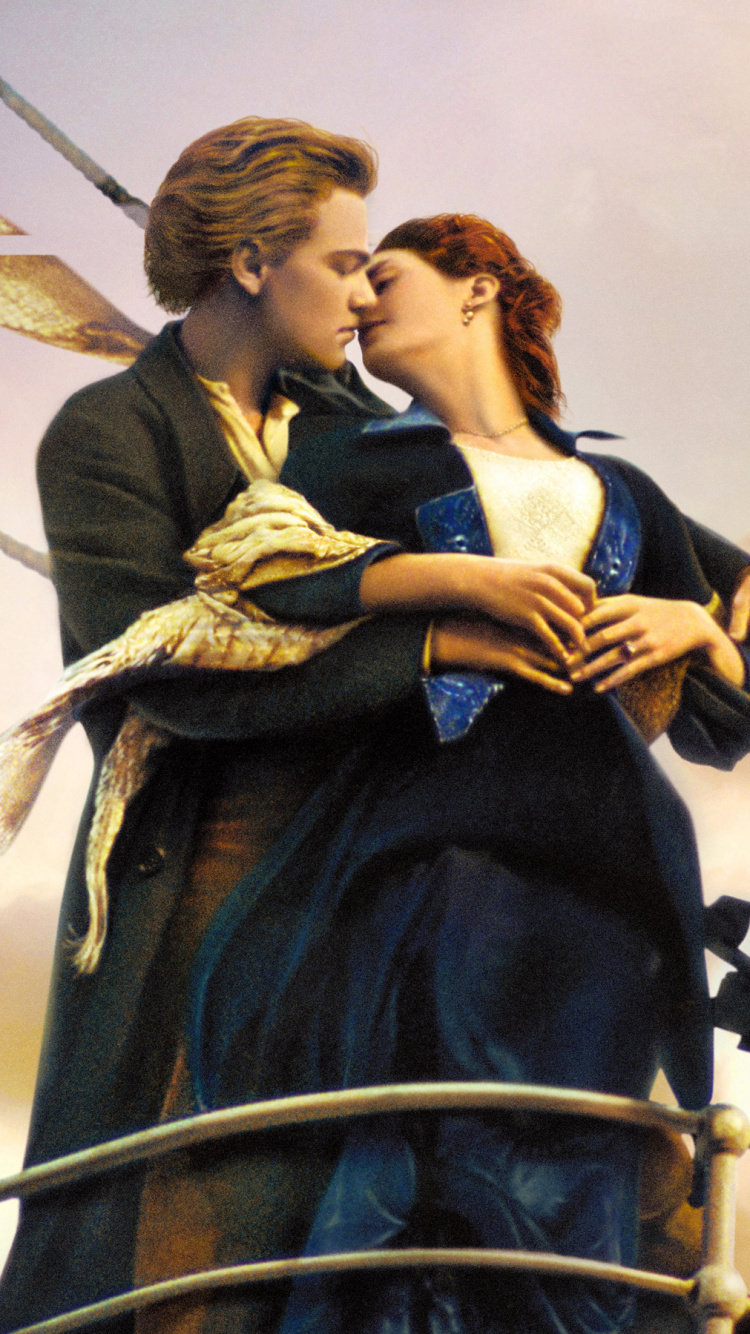 Woman in Black Dress Holding Man in Black Suit. Wallpaper in 750x1334 Resolution