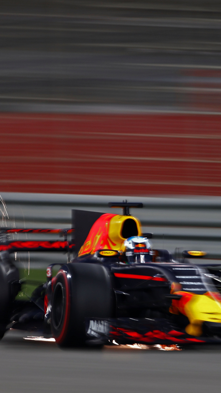 Coche de Carreras Rojo y Negro f 1 en la Pista. Wallpaper in 750x1334 Resolution