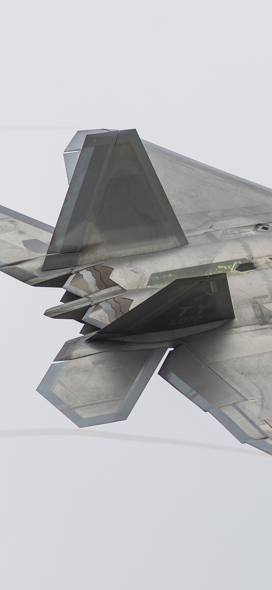 Gray Fighter Jet in Mid Air. Wallpaper in 1125x2436 Resolution