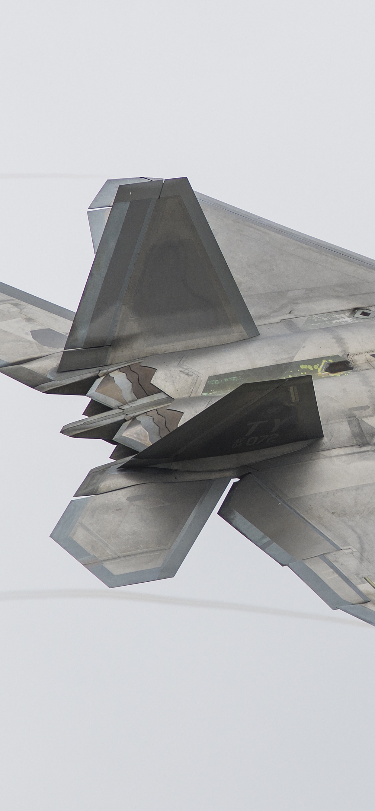 Gray Fighter Jet in Mid Air. Wallpaper in 1242x2688 Resolution