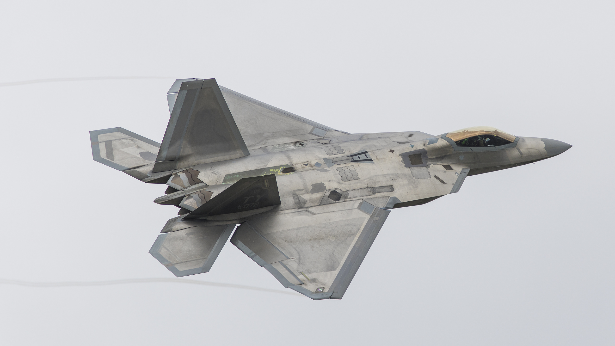 Gray Fighter Jet in Mid Air. Wallpaper in 2560x1440 Resolution