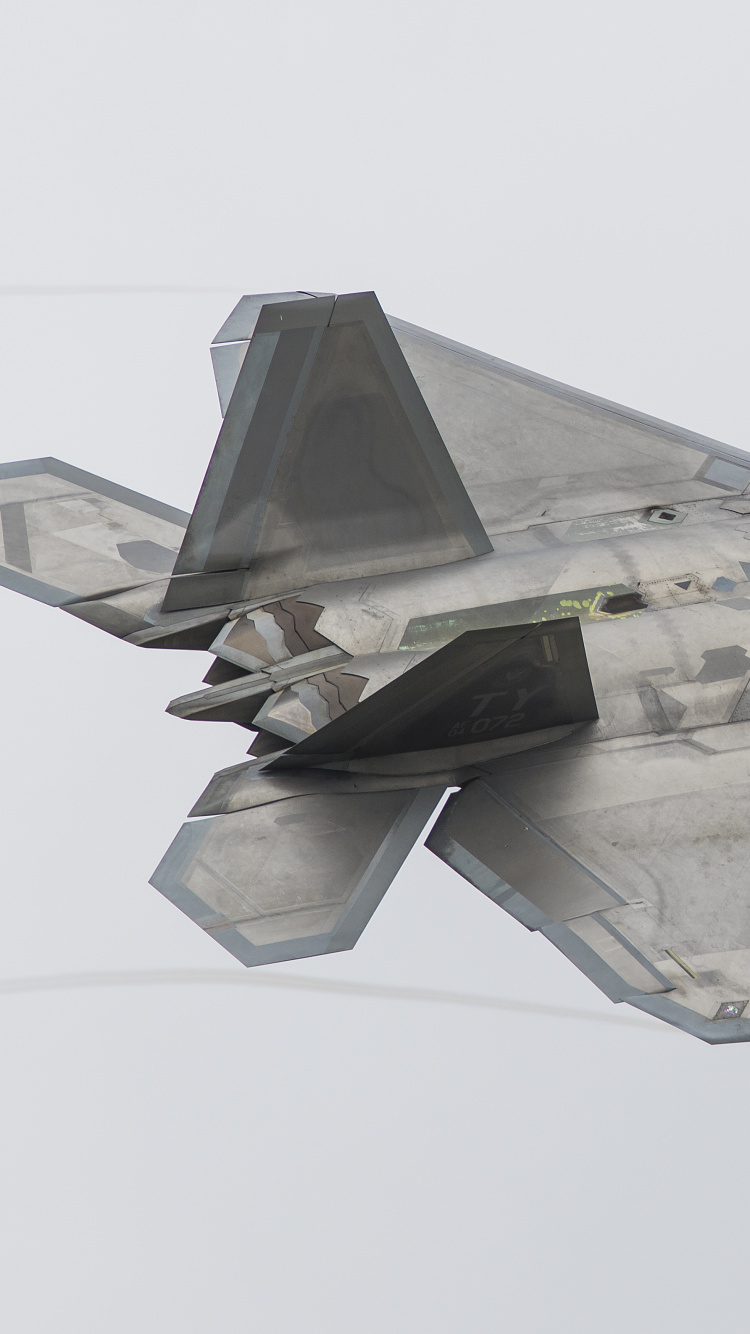 Gray Fighter Jet in Mid Air. Wallpaper in 750x1334 Resolution