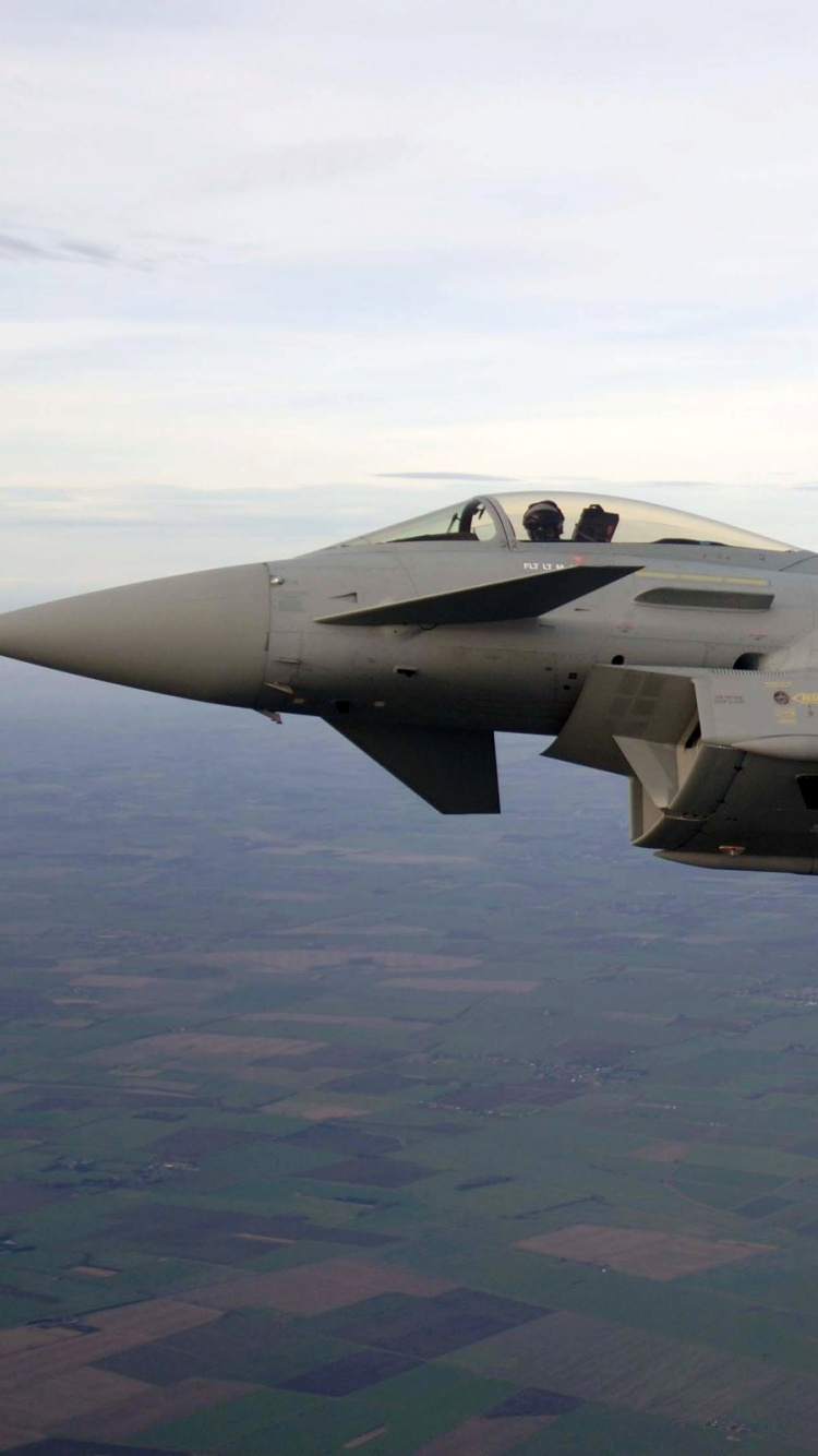 Gray Fighter Jet Flying Over The Sky During Daytime. Wallpaper in 750x1334 Resolution