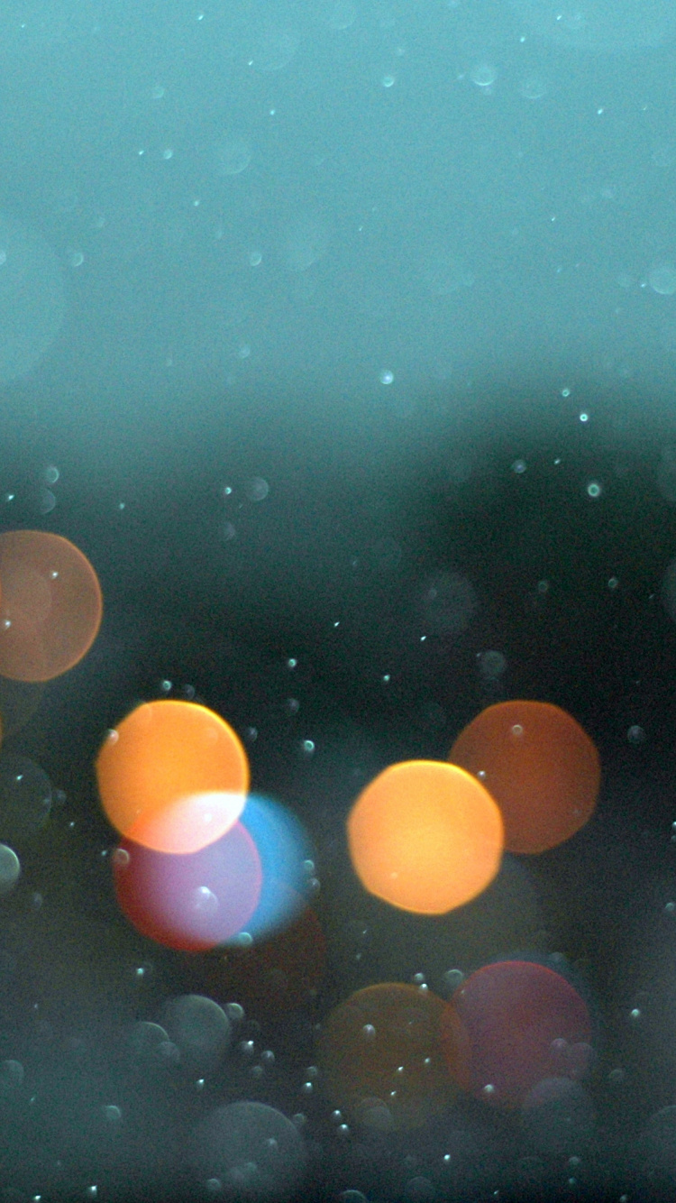 Yellow and Orange Balloons in Water. Wallpaper in 750x1334 Resolution
