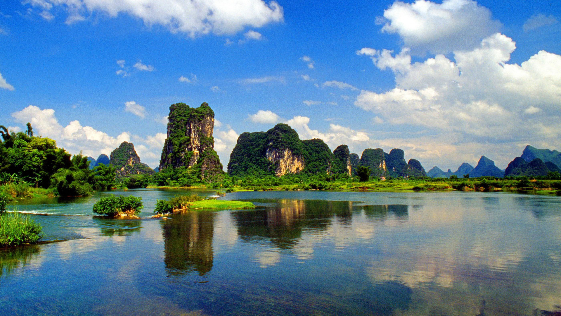 Green Trees Near Lake Under Blue Sky and White Clouds During Daytime. Wallpaper in 1920x1080 Resolution