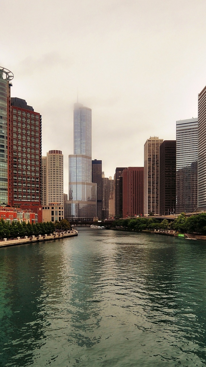 Body of Water Between High Rise Buildings During Daytime. Wallpaper in 720x1280 Resolution