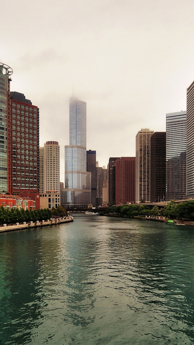 Body of Water Between High Rise Buildings During Daytime. Wallpaper in 750x1334 Resolution