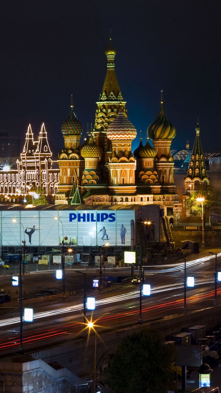 Edificio de Hormigón Blanco y Marrón Durante la Noche.. Wallpaper in 720x1280 Resolution