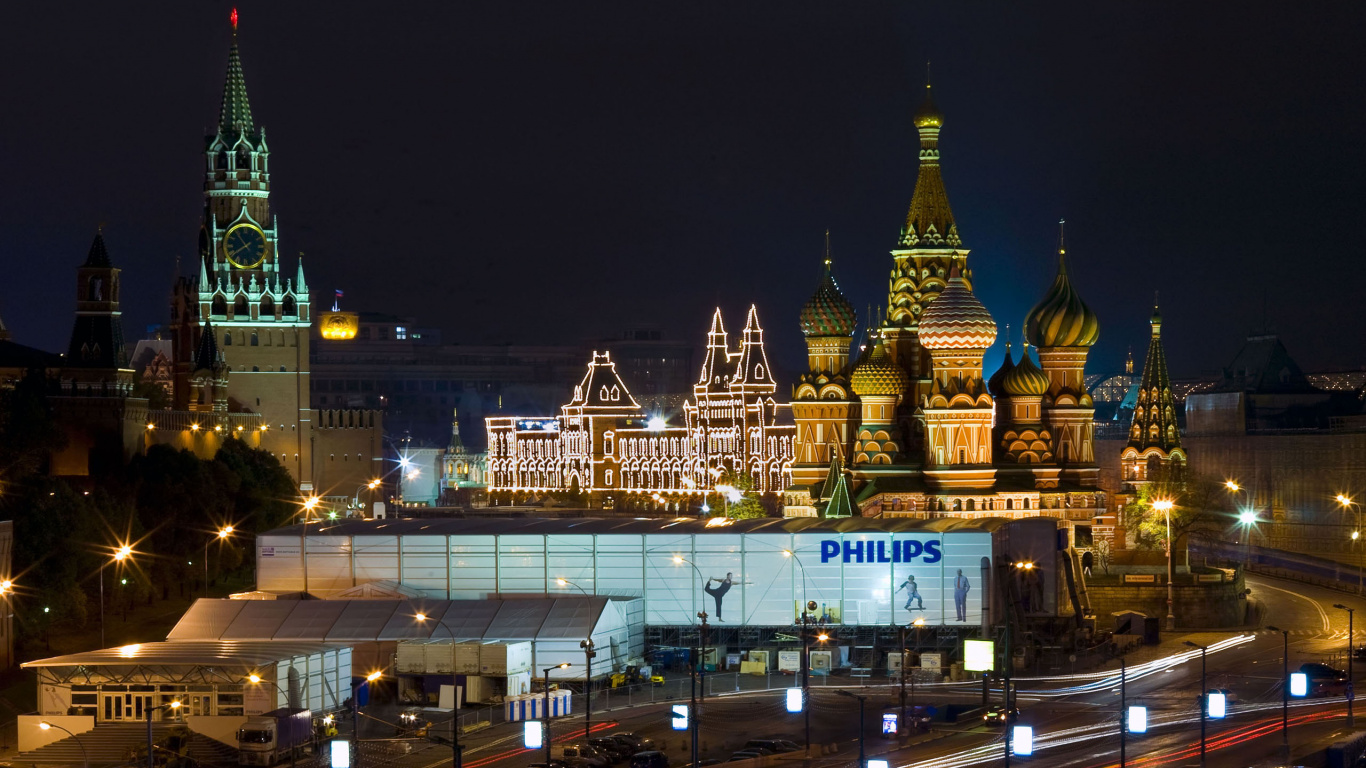 White and Brown Concrete Building During Night Time. Wallpaper in 1366x768 Resolution