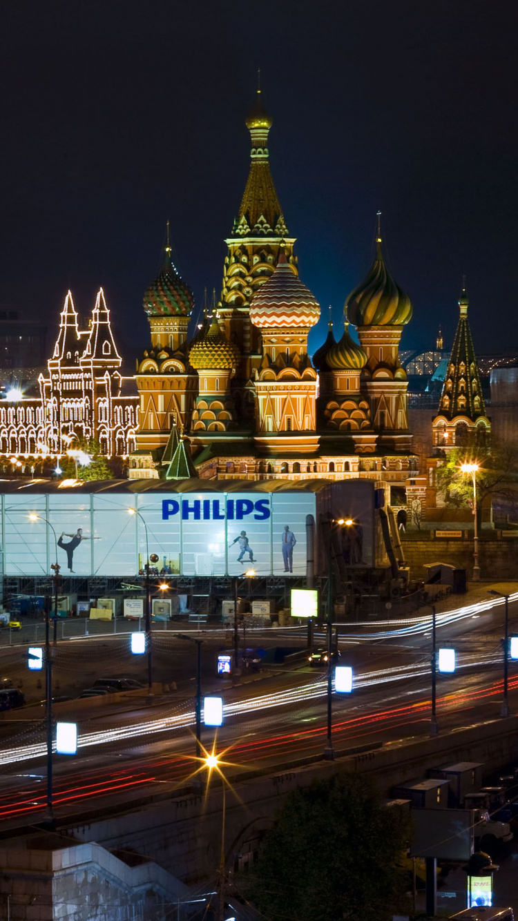 White and Brown Concrete Building During Night Time. Wallpaper in 750x1334 Resolution