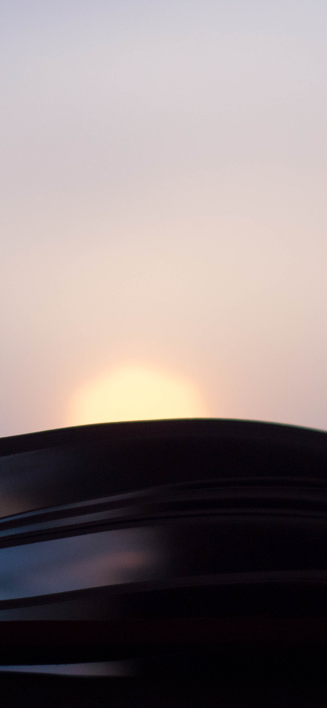 Black Car on Road During Sunset. Wallpaper in 1125x2436 Resolution