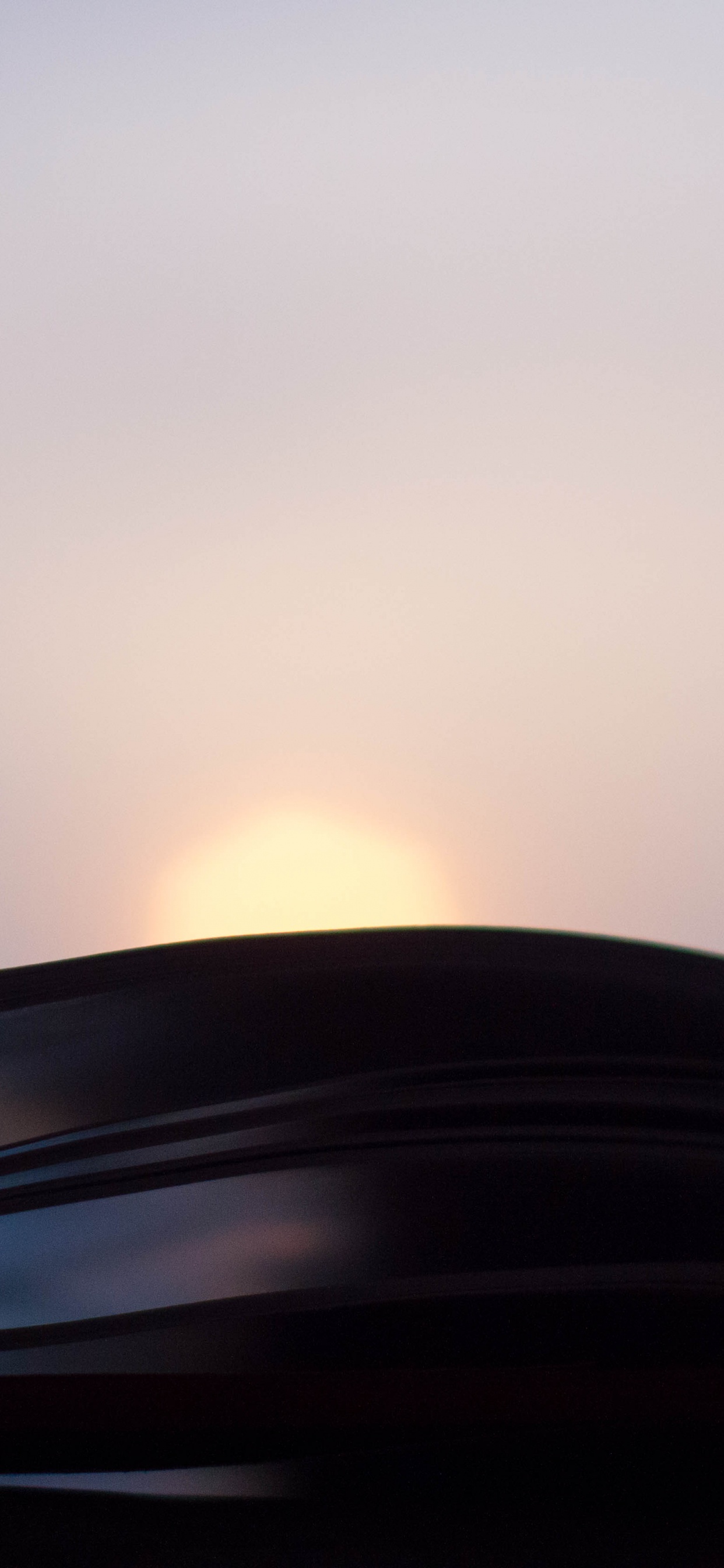 Black Car on Road During Sunset. Wallpaper in 1242x2688 Resolution