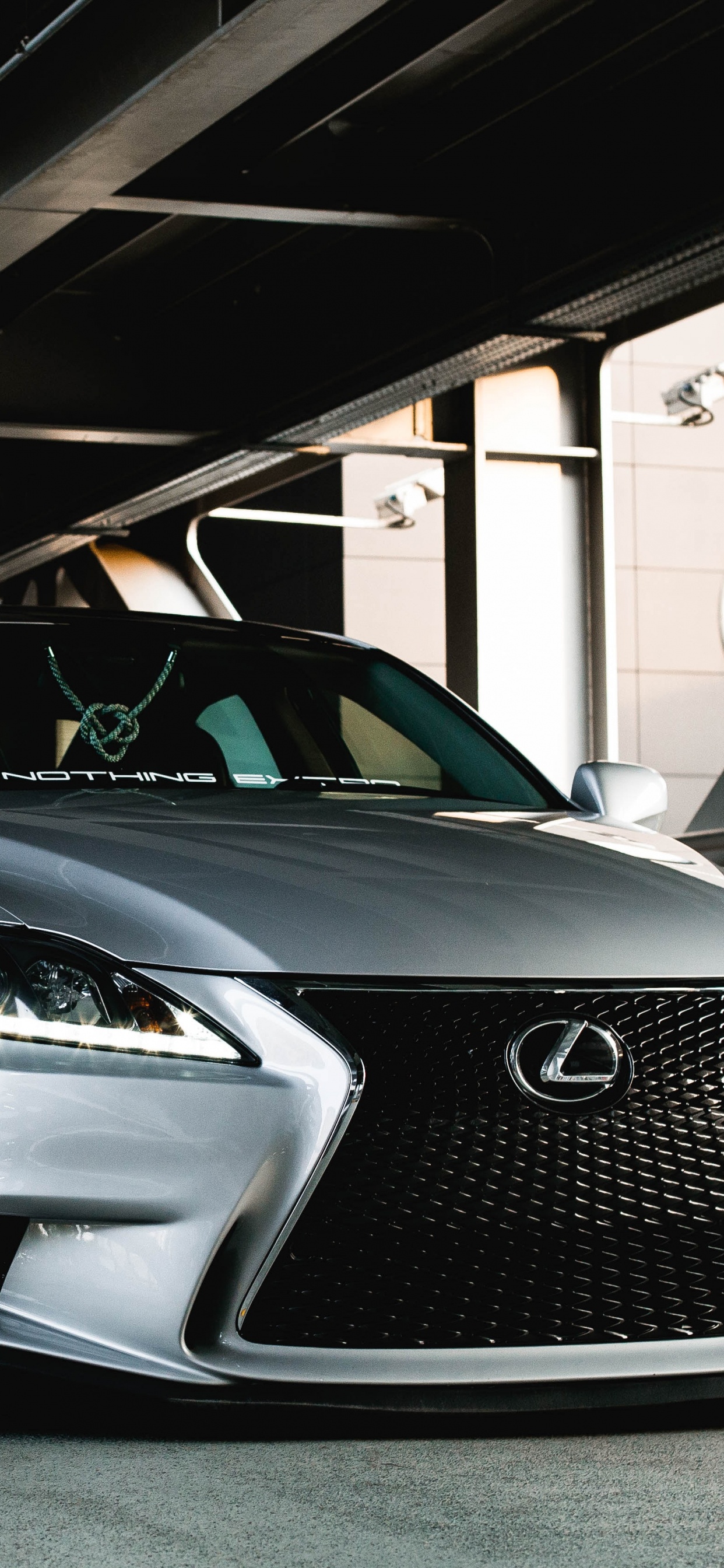 Silver Mercedes Benz Coupe Parked in Garage. Wallpaper in 1242x2688 Resolution