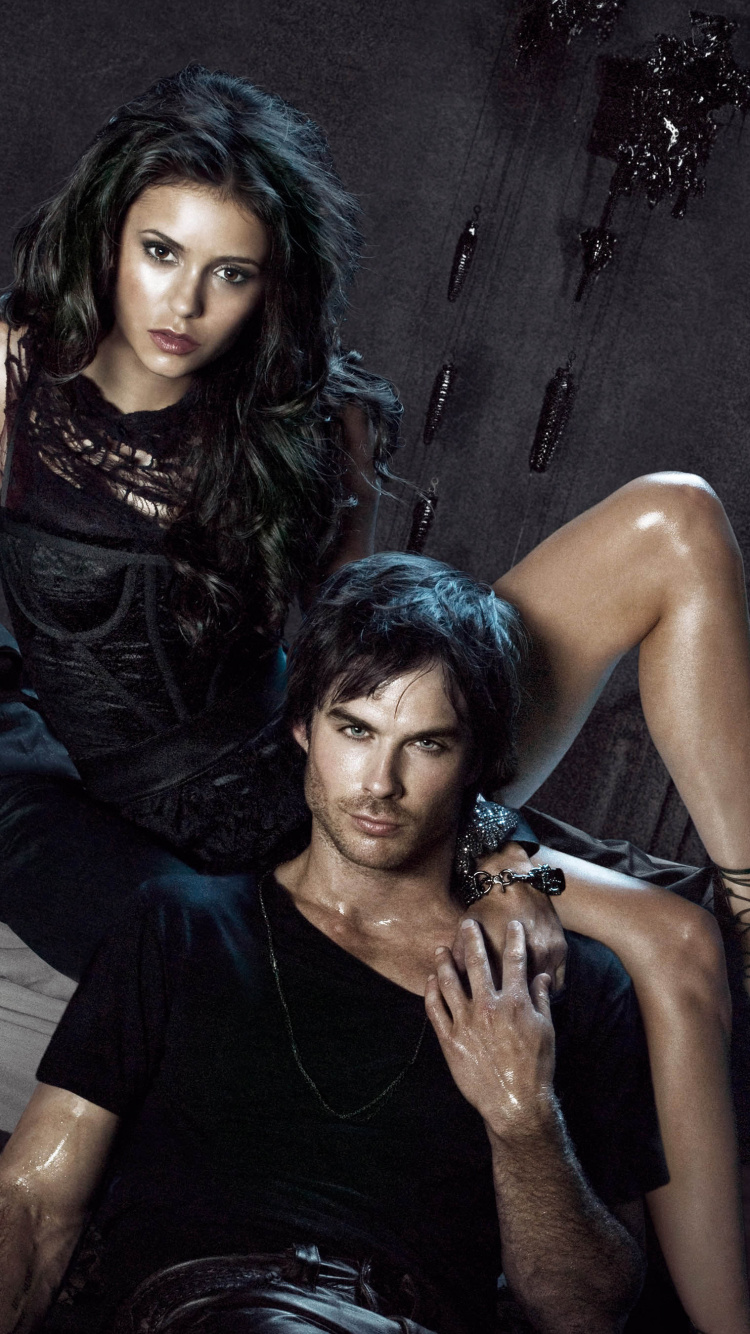 Woman in Black Tank Top and Blue Denim Jeans Lying on Bed. Wallpaper in 750x1334 Resolution