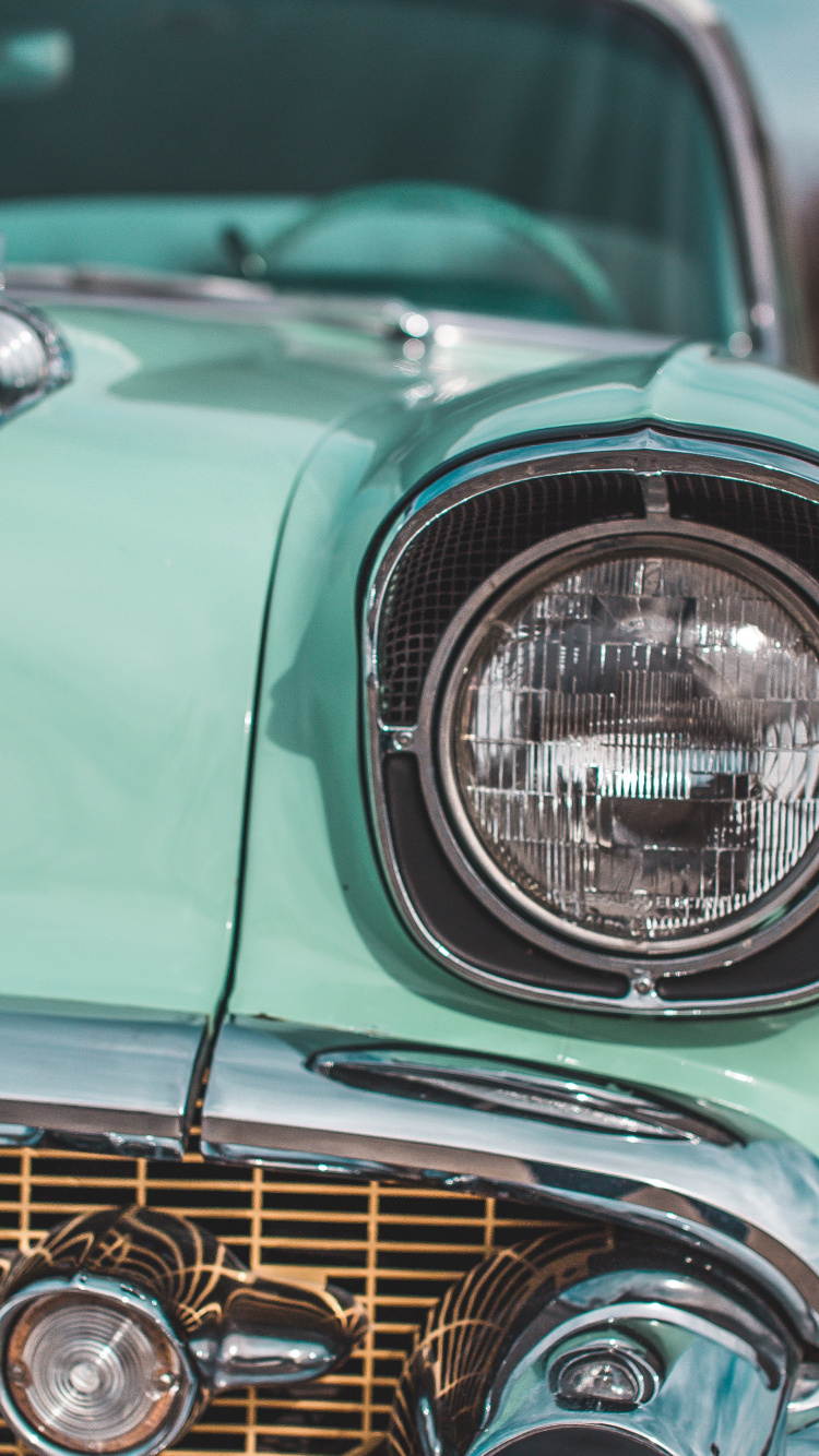 Green Car With White Light. Wallpaper in 750x1334 Resolution