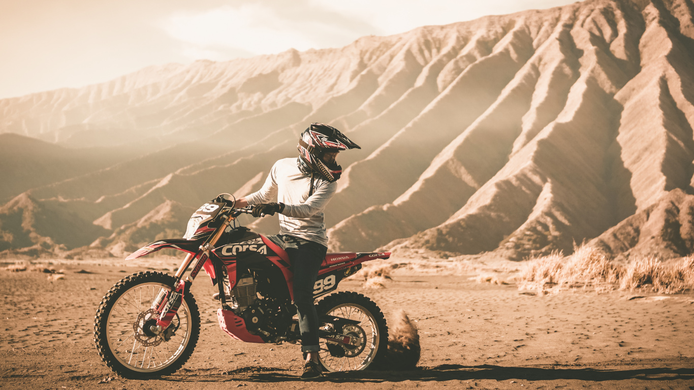 Man Riding Motocross Dirt Bike on Dirt Road During Daytime. Wallpaper in 1366x768 Resolution