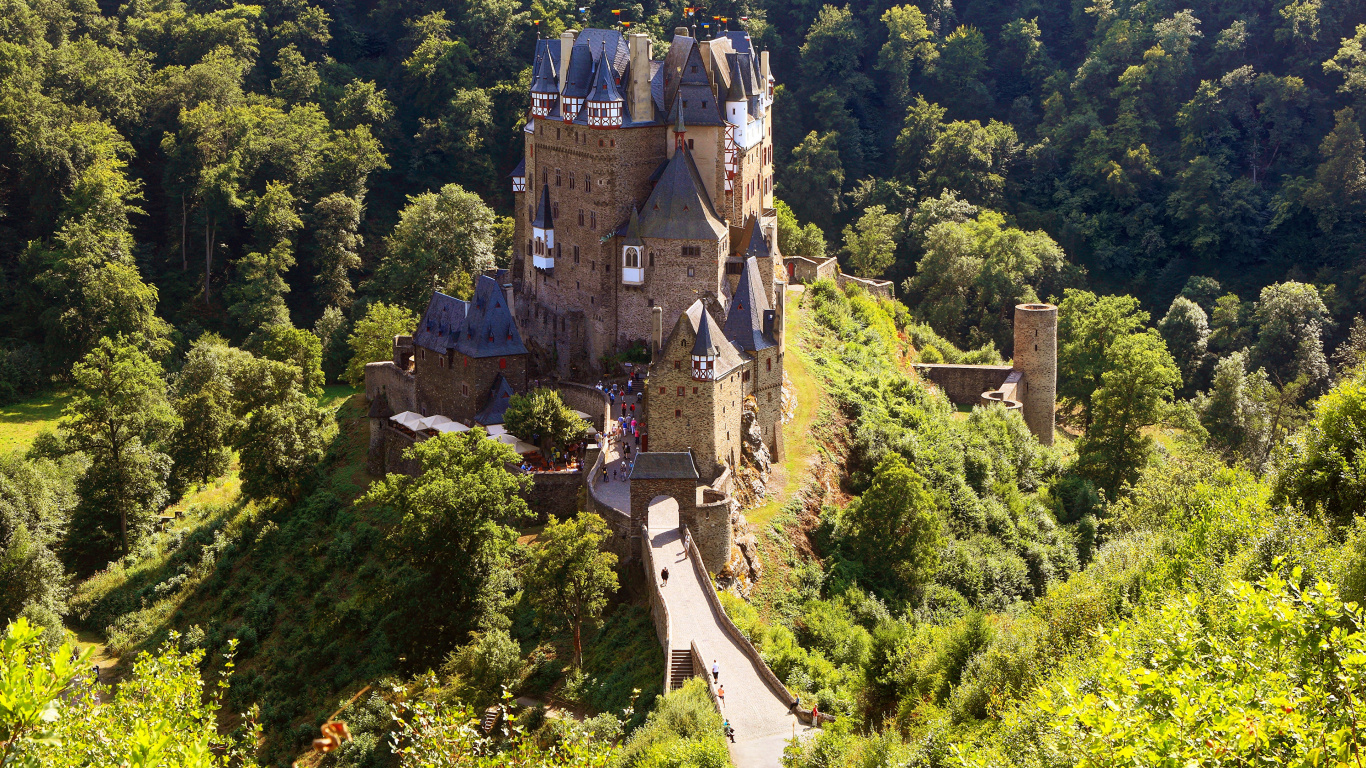 Aerial View of Gray Castle Surrounded by Green Trees During Daytime. Wallpaper in 1366x768 Resolution