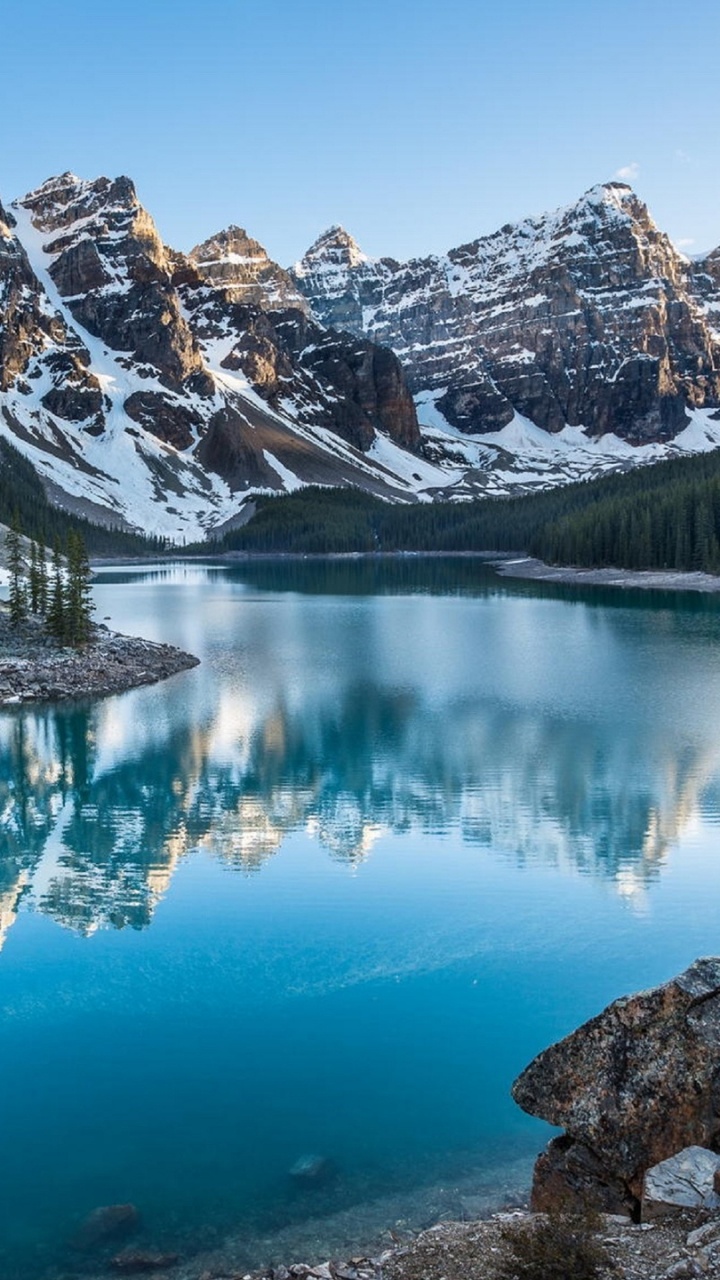 Lake Surrounded by Trees and Mountains During Daytime. Wallpaper in 720x1280 Resolution