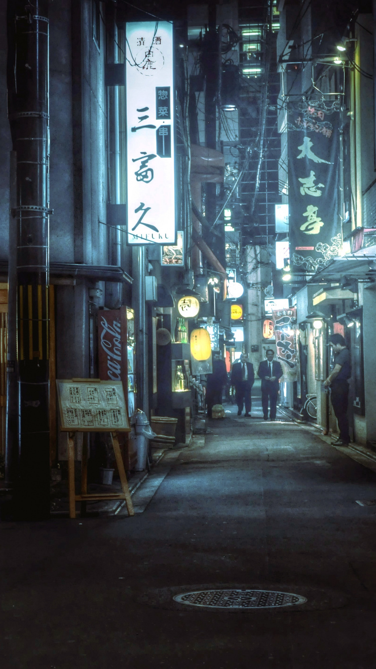People Walking on Street During Nighttime. Wallpaper in 750x1334 Resolution