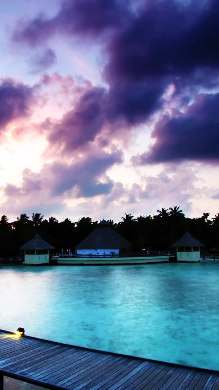 Blue Swimming Pool Under Cloudy Sky During Daytime. Wallpaper in 720x1280 Resolution