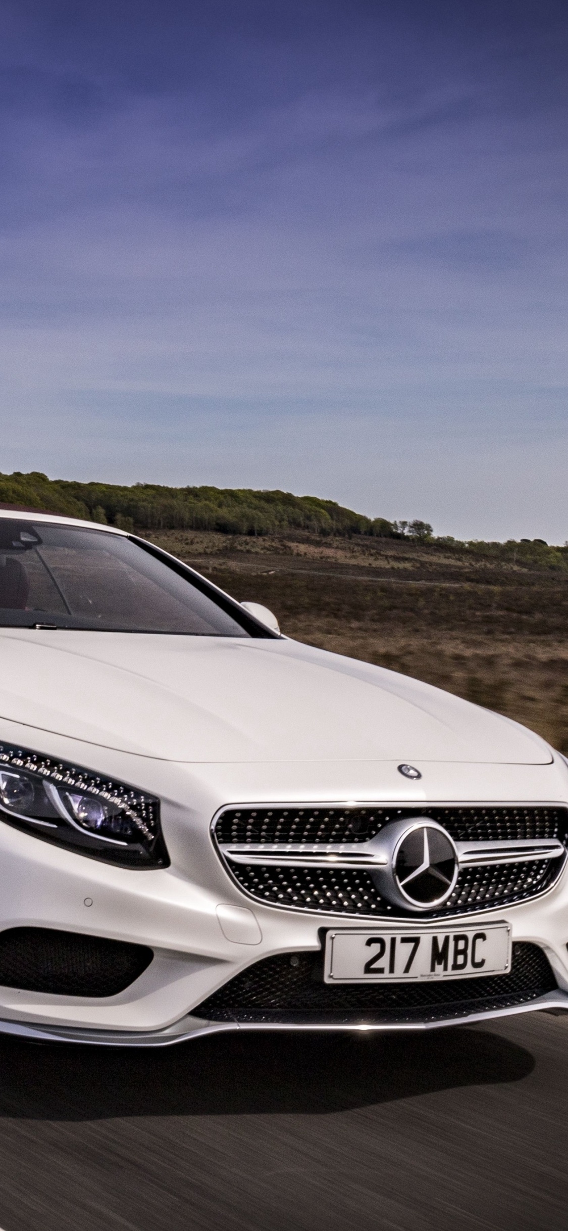 White Mercedes Benz Coupe on Road During Daytime. Wallpaper in 1125x2436 Resolution