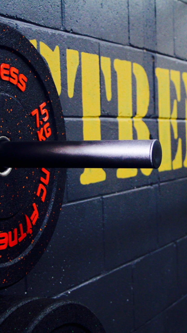 Schwarz-gelbe Runde Metallplatte. Wallpaper in 720x1280 Resolution