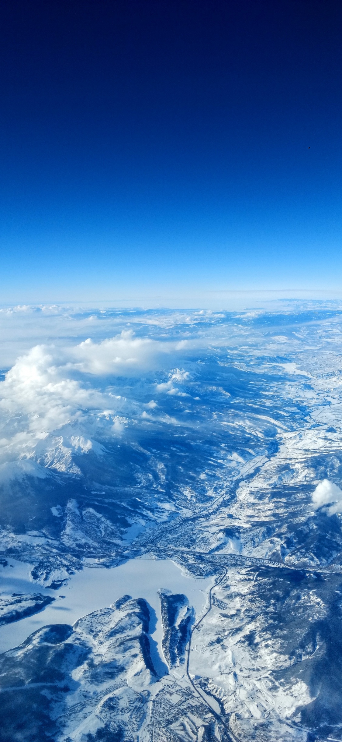 Download 1125x2436 Wallpaper Atmosphere, Earth, Cloud, Mountain Range, Outer Space Atmosphere, Earth, Cloud, Mountain Range, Outer Space. Wallpaper in 1125x2436 Resolution
