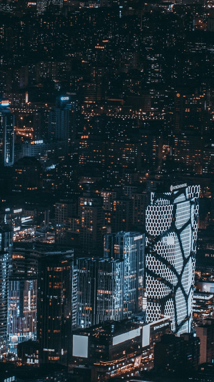 Vue Aérienne Des Bâtiments de la Ville Pendant la Nuit. Wallpaper in 750x1334 Resolution