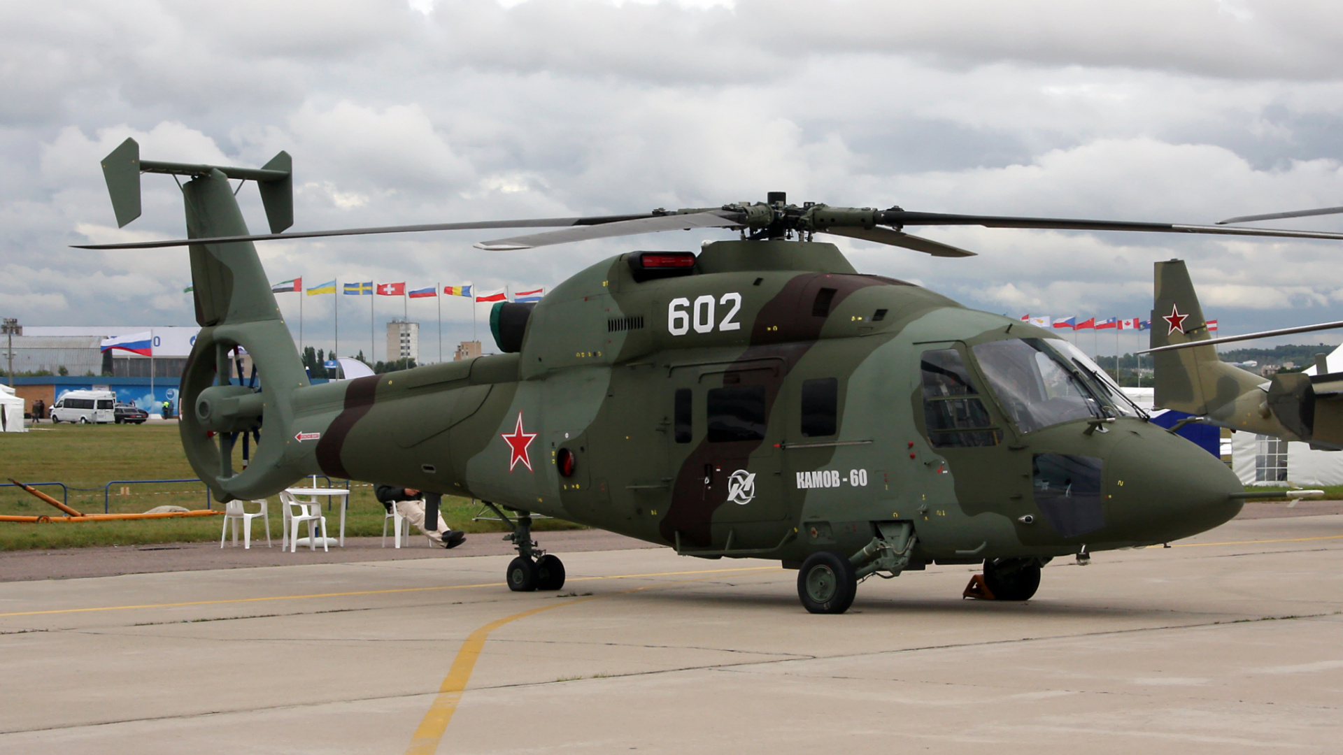Green and Black Helicopter on Airport During Daytime. Wallpaper in 1920x1080 Resolution