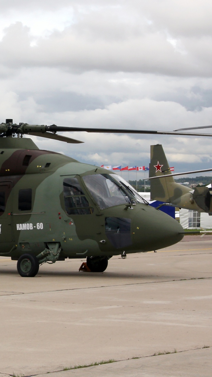 Green and Black Helicopter on Airport During Daytime. Wallpaper in 720x1280 Resolution