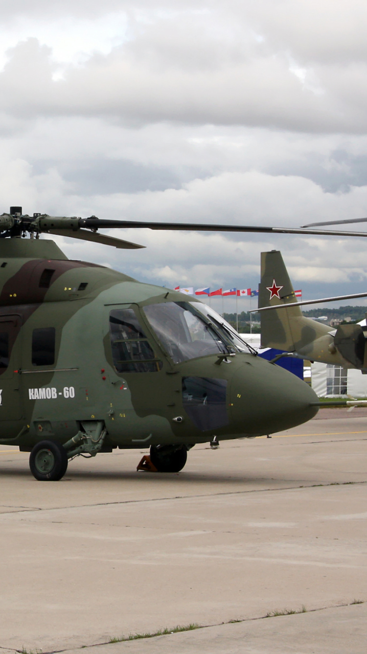 Green and Black Helicopter on Airport During Daytime. Wallpaper in 750x1334 Resolution