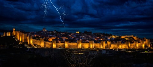 Image city skyline under blue sky and white clouds during night time