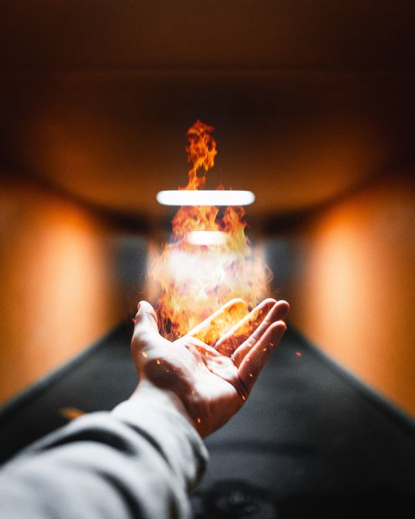 person holding fire during night time