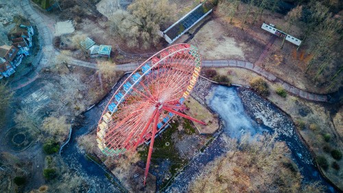 Image aerial view of red and blue ferris wheel