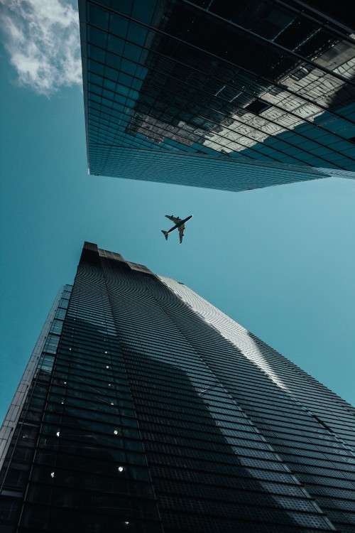 Image airplane, flight, aircraft, building, skyscraper