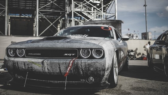 Image gray and black sports car on road during daytime