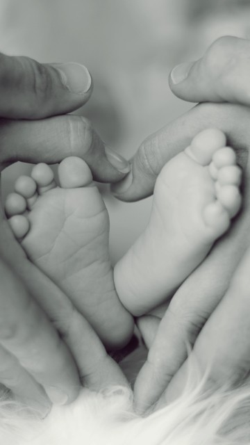 Image grayscale photo of persons feet