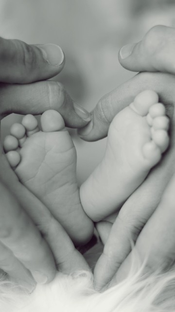 Image grayscale photo of persons feet