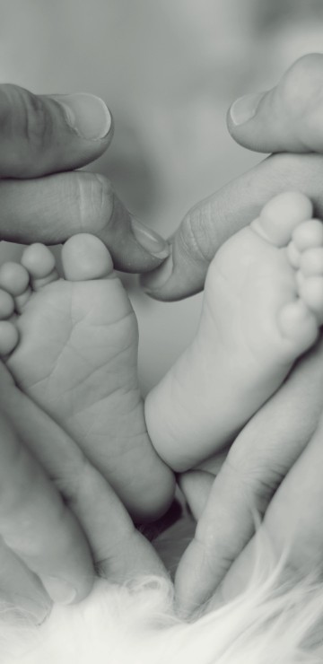 Image grayscale photo of persons feet