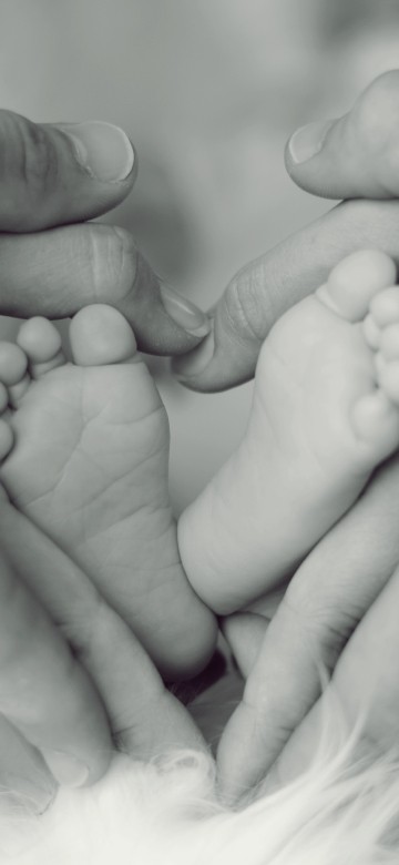 Image grayscale photo of persons feet