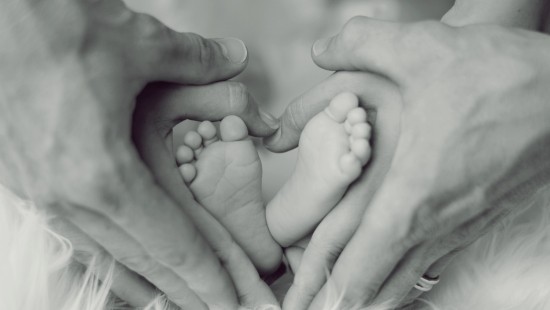 Image grayscale photo of persons feet