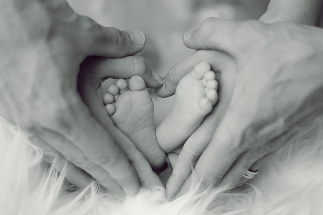 grayscale photo of persons feet