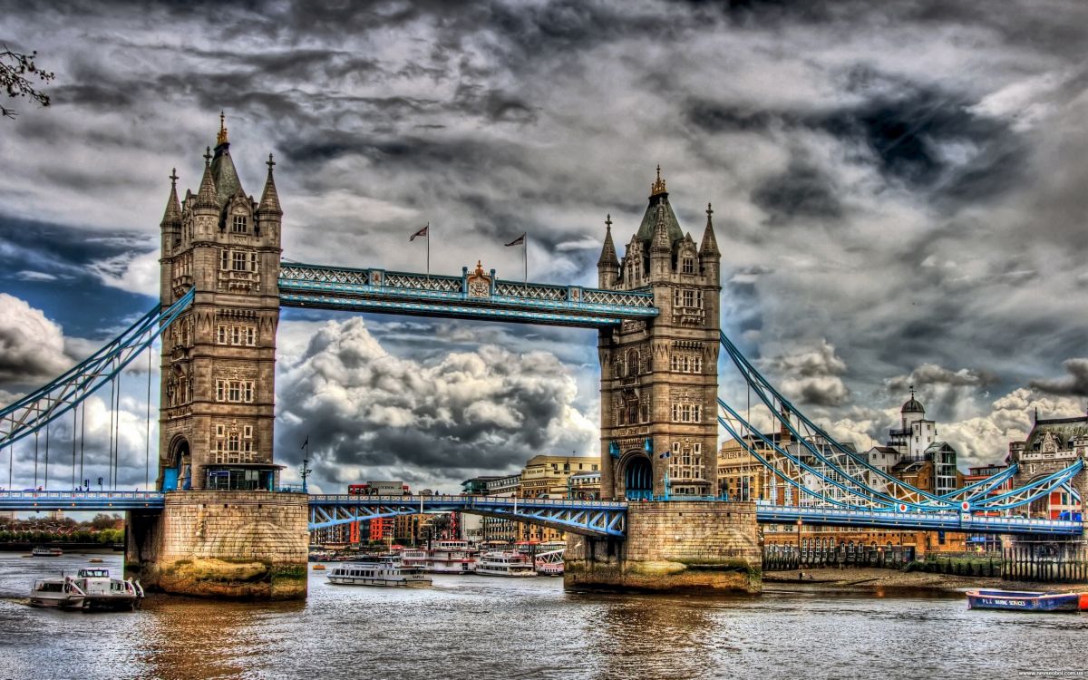 gray bridge under gray clouds